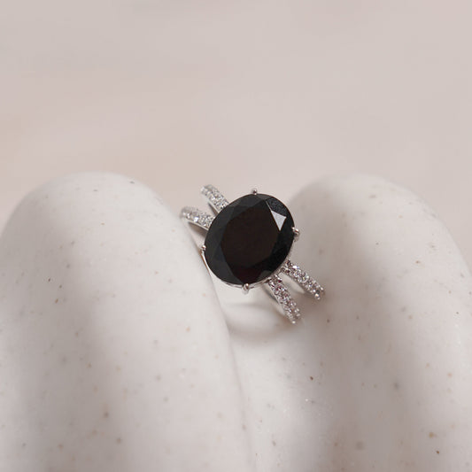  a black onyx ring with a double band design and cubic zirconia-studded infinity band.