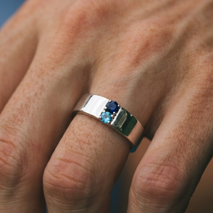 Close-up of a hand wearing a silver ring with Blue Topaz Gemstone make in 925 silver 