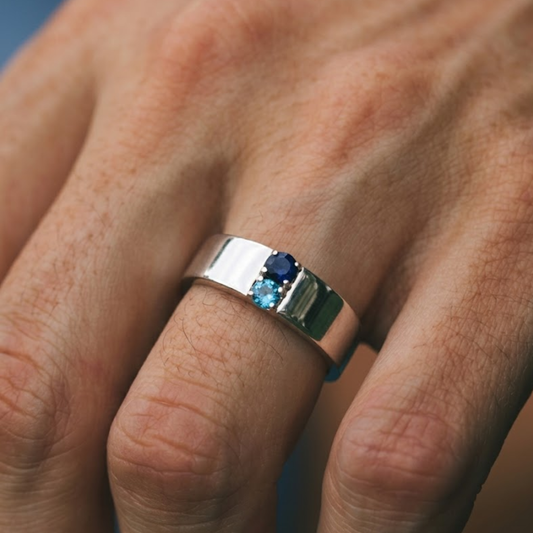 Close-up of a hand wearing a silver ring with Blue Topaz Gemstone make in 925 silver 